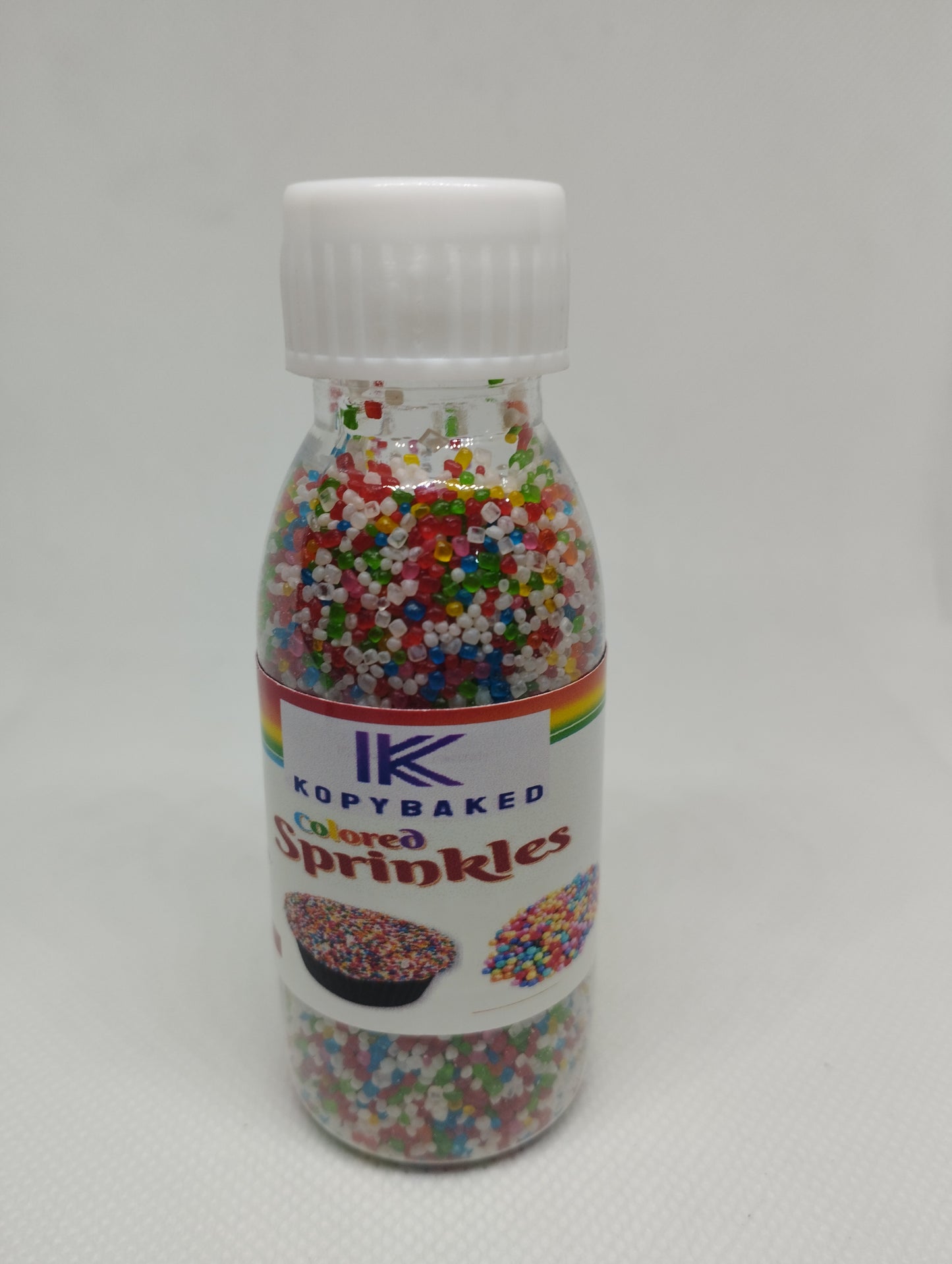 Rainbow Sugar Mini Balls 50 gm. Bottle use for Cakes decoration , pastries, Donuts, cupcake, ice-cream , milk shake, cakes etc
